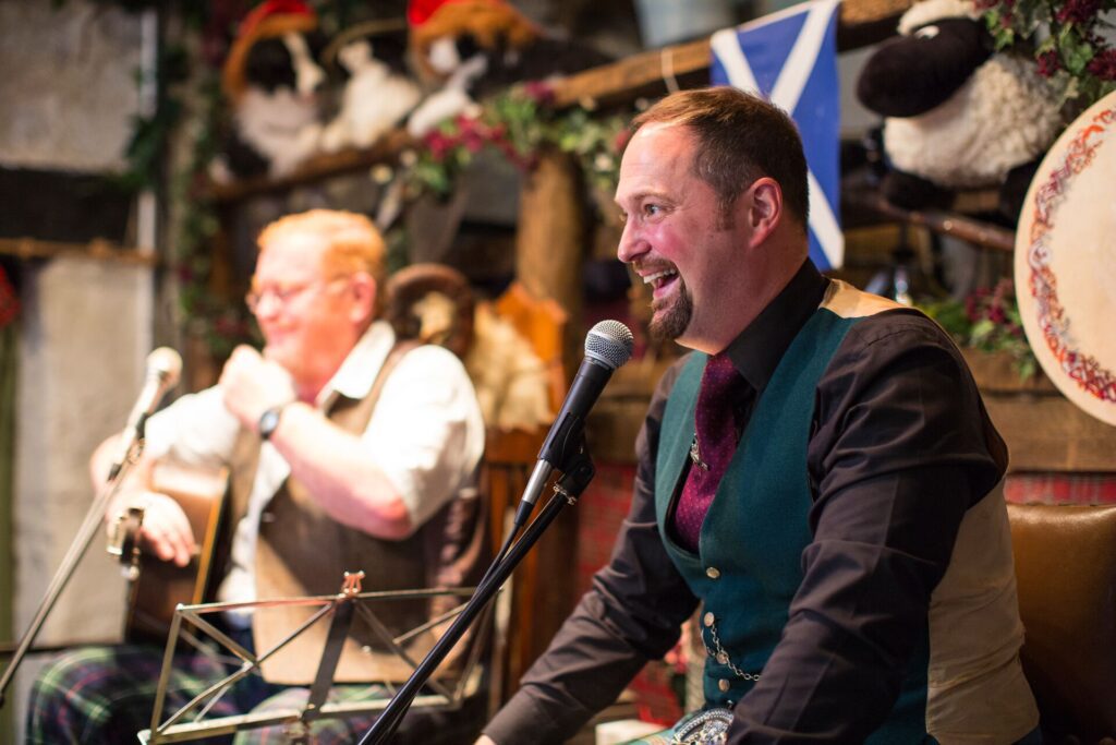 Fergus and Gregor Wood playing music on a Be My Guest experience