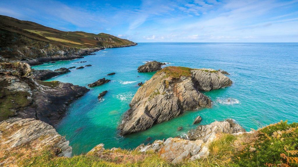blue water rocky cliffs England coast