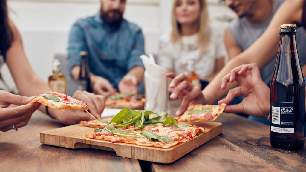 People eating pizza at Vaduz restaurants, cafés and bars