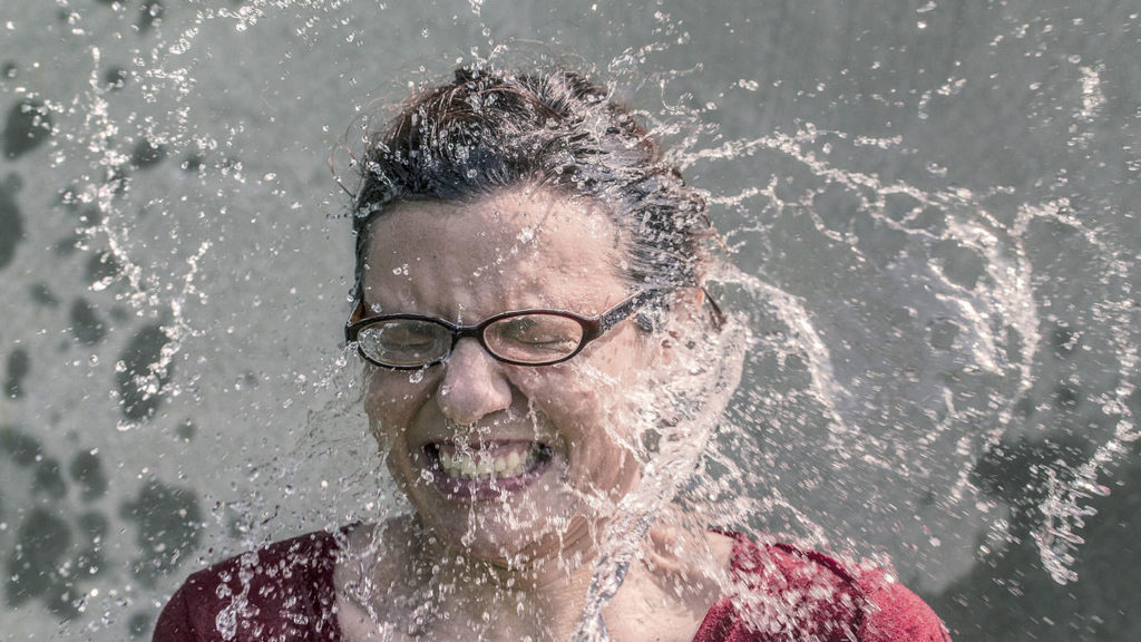 Woman splashed with waterr