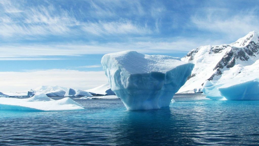 glowing blue iceberg Antarctica celebrate retirement