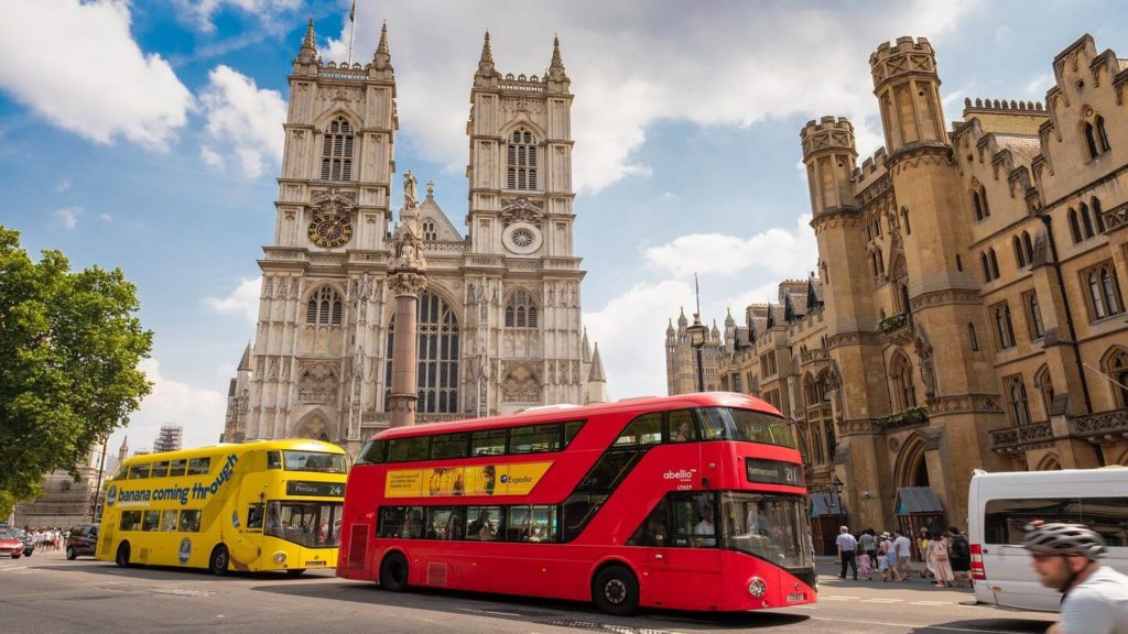 iconic red bus old buildings London