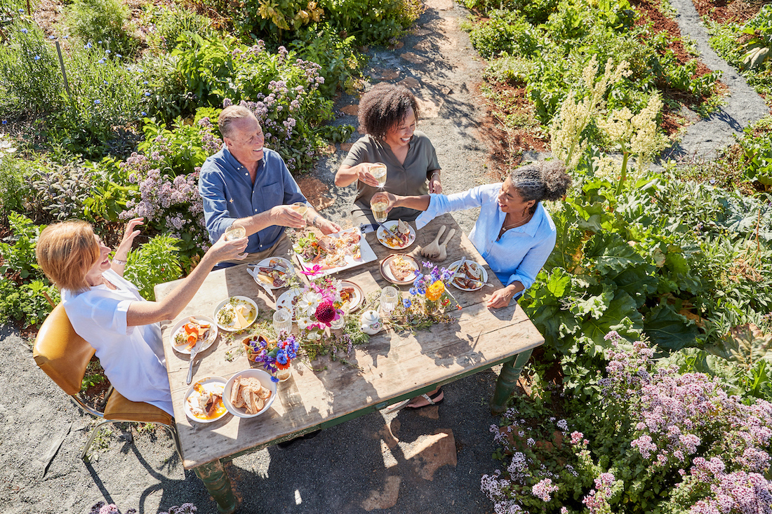 group of friends eating dinner on a trafalgar private group tour