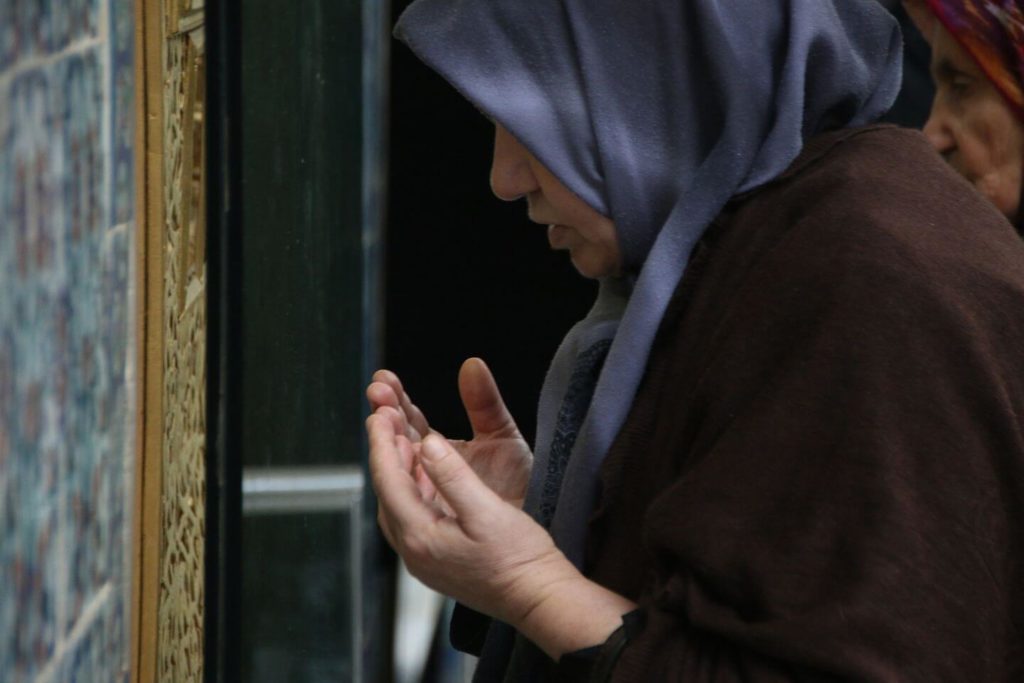 Muslim woman praying at Ramadan