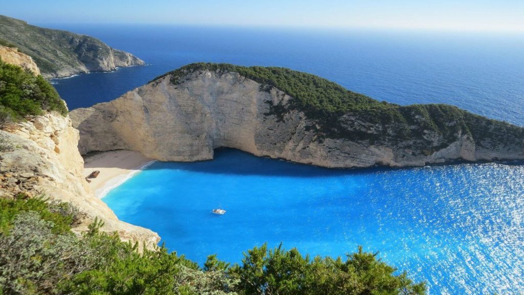 blue ocean green cliffs Zakynthos Greece
