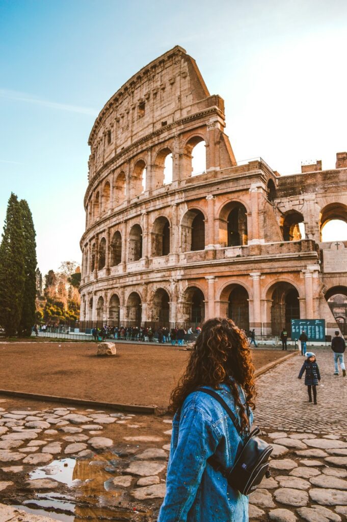 traveller looking at the Colosseum in Rome Italy tour