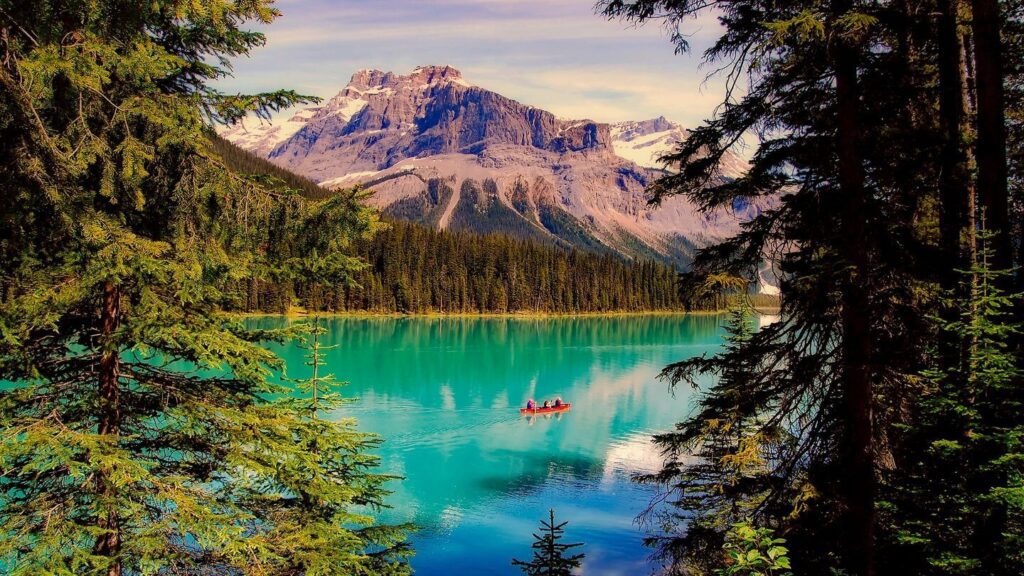blue lake snowy mountains Canadian rockies travel and sustainability