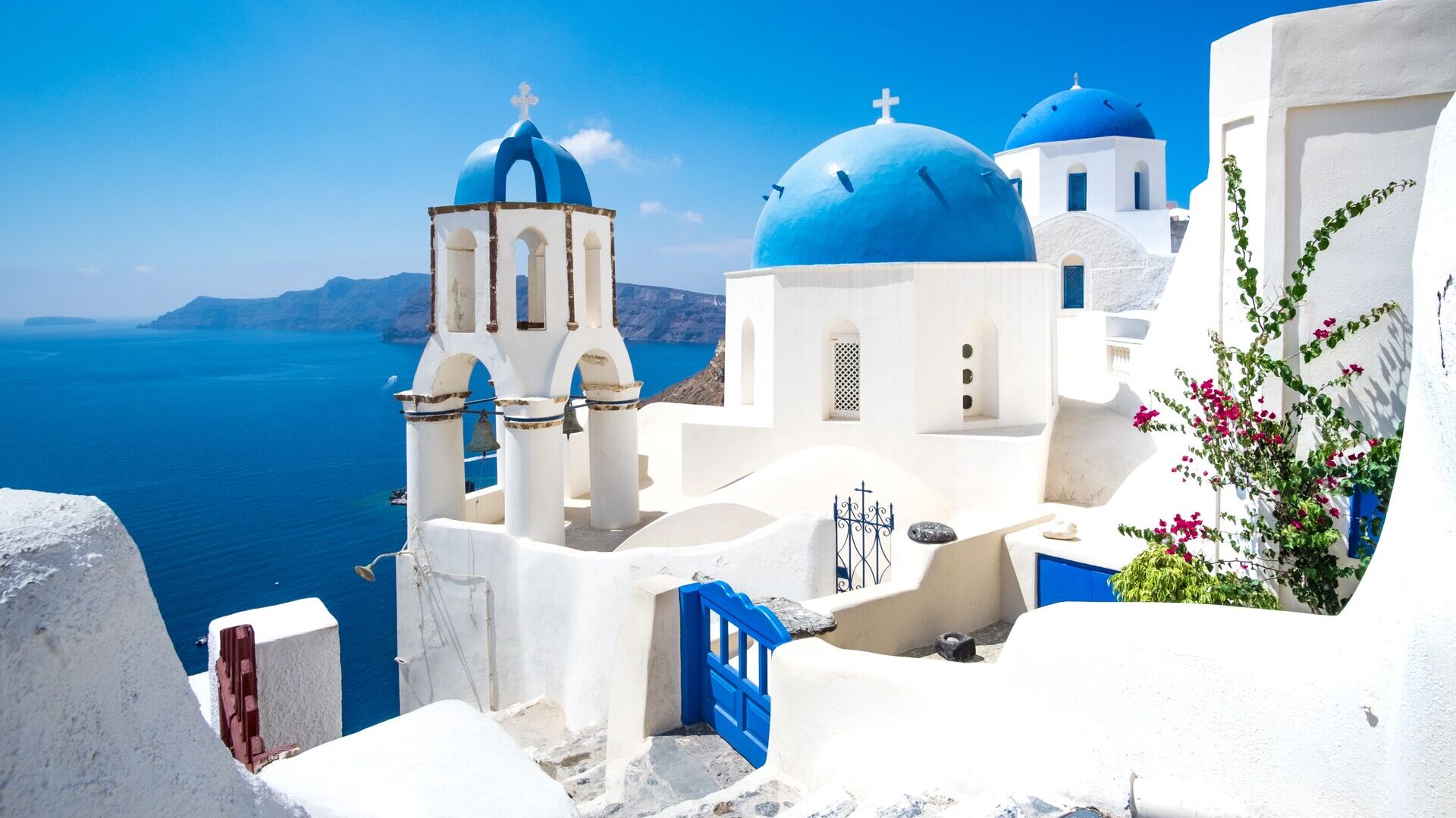 white houses and blue domes on greek island Santorini