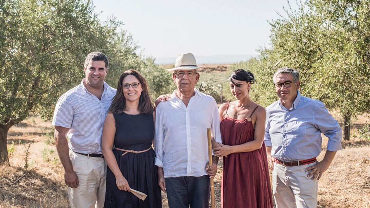 family standing in an olive grove Trafalgar Be My Guest experiences