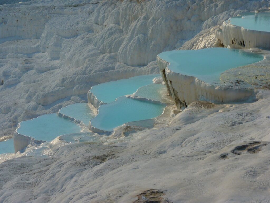 blue water and white terraces of Pamukkale in Turkey