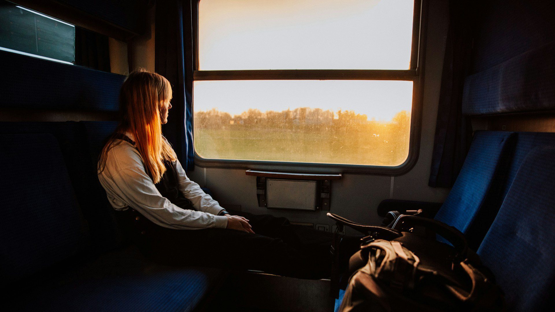 Woman looking out the window of a train